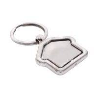 Metalowy brelok w kształcie domku, zamocowany w ramce, obrotowy, dwustronny