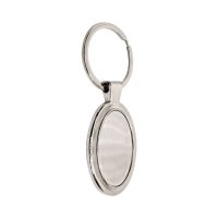 Owalny, metalowy brelok z zawieszką