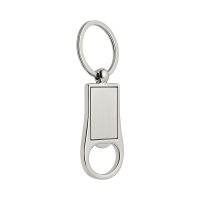 Prostokątny, metalowy brelok połączony z otwieraczem