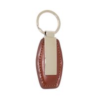 Brelok z brązowej ekoskóry z metalowym panelem do graweru